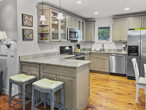 Open kitchen with all the amenities + Bar Seating for 2