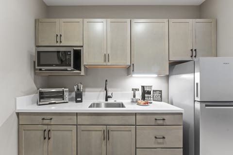 Savor a fresh brew at the Coffee Bar in a sleek kitchenette w/ modern appliances