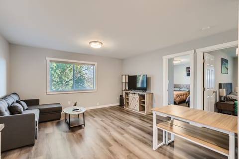 Living room with 50" UHD TV. Disney+, HBO MAX, and Amazon Prime Video