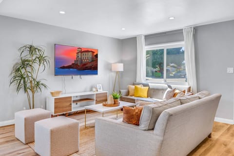 Cozy living room with a perfect television to watch and relax! 