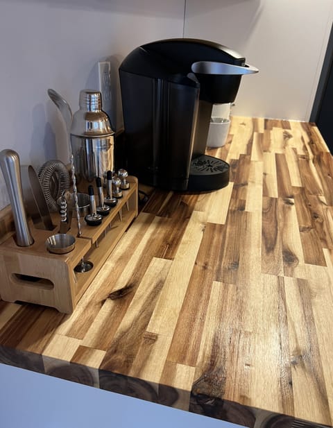 A coffee and drink station complete with K cups and sugar