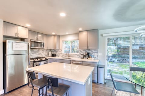 Contemporary kitchen with stainless steel appliances and quartz counter top