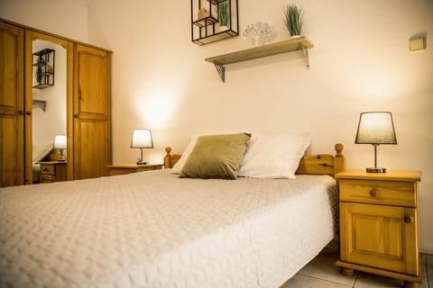 double bed,bedside tables, night lamps,wardrobe,