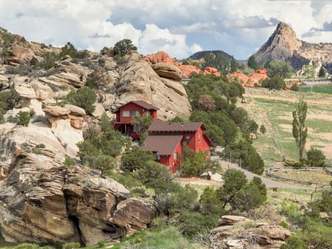 Aerial view of the cottage, with the Cocks Comb ridge in the background.