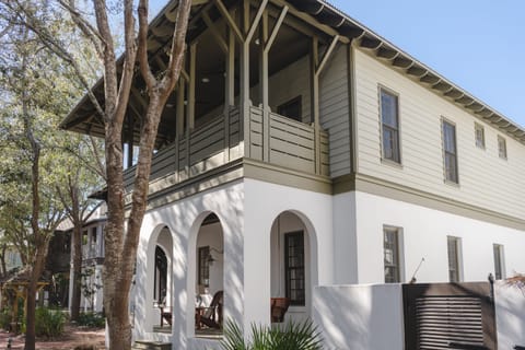 White stucco porch arches.