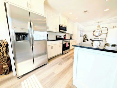 Cook, store, and clean in a brightly lit kitchen.