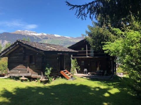 Photo of the accommodation comprising two chalets, the main chalet on two levels.