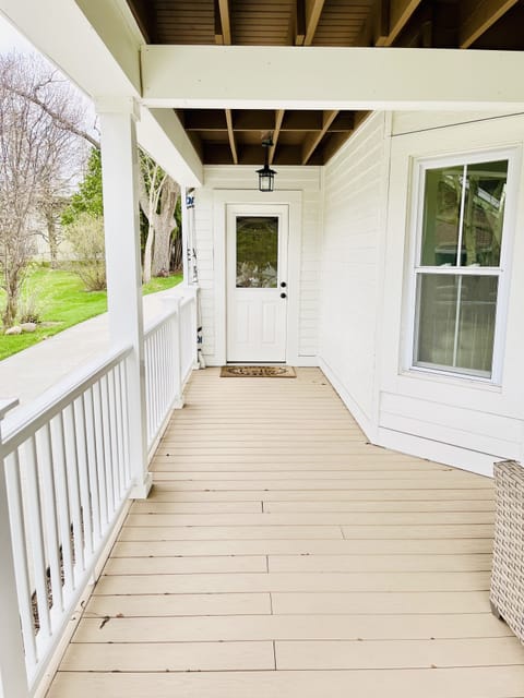 Private entrance from main floor bedroom to wraparound porch.