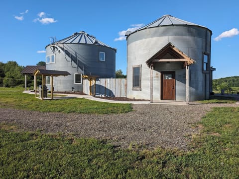 The Rustic Roundhouse is on the right side.... the smaller of the two silos.
