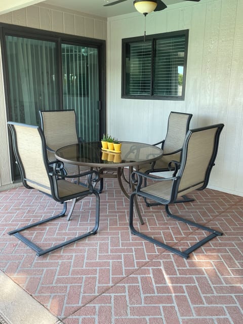 Covered patio area with grill