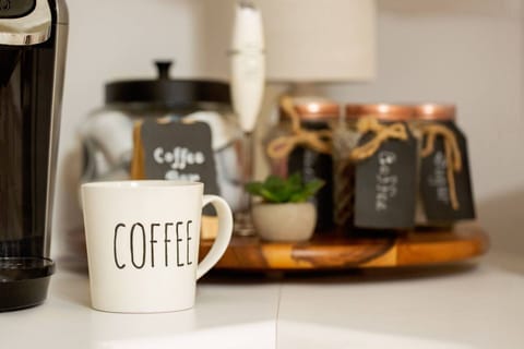 Start your day right with a hot cup of coffee from the coffee bar - Keurig coffee maker, K-cups, and sugar provided.
