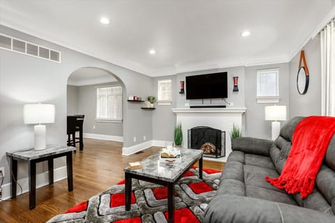 Watch your favorite show on the large smart TV above the intimate fireplace.