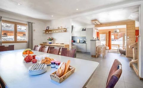 Chat with friends and family around the spacious dining table.