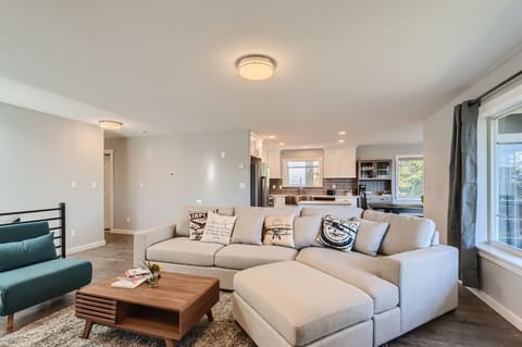 Living room with a sectional sofa perfect for your lounge day during your trip.