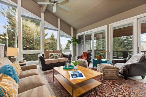 Mountain contemporary furnishings, smart TV, cozy gas fireplace, vaulted ceiling, and patio access with breathtaking ski resort/golf course views