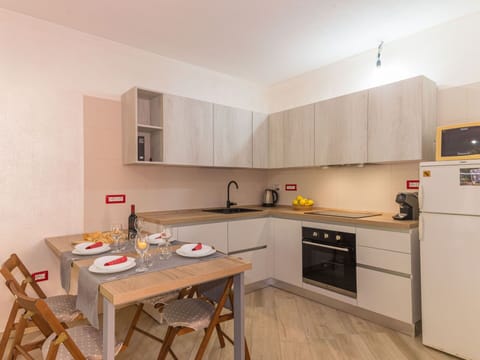 Furniture, Cabinetry, Countertop, Table, Wood, Kitchen Stove, Building, Kitchen Appliance, Cooktop, Flooring