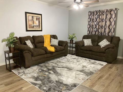 Kick back and relax in our living room complete with 55" TV and workstation.