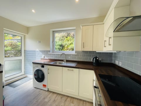 From the kitchen you can access the back garden and patio area