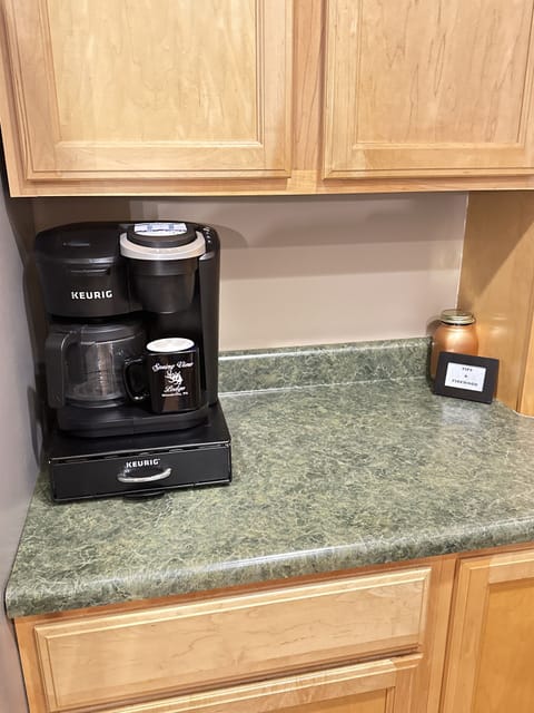 Drip and K-cup machine with supplied coffee and tea.