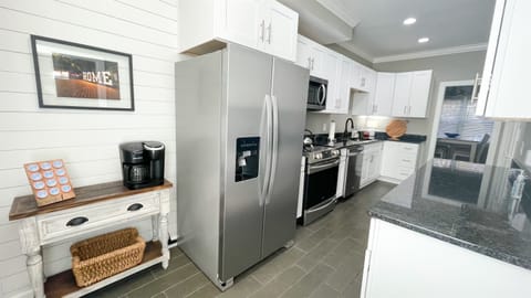 Large kitchen with a stocked coffee bar