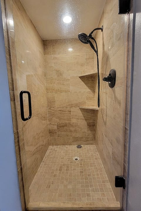 Texas  Room with the  stand up  tile shower  w/ massage shower head 