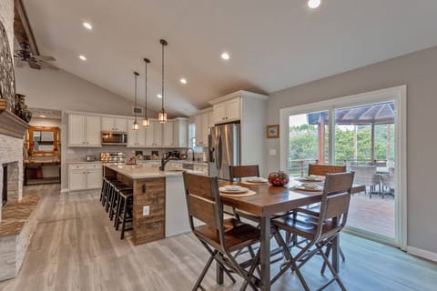 Room for the whole family to enjoy a meal with a dedicated dining table, kitchen island seating, and an outdoor dining table.