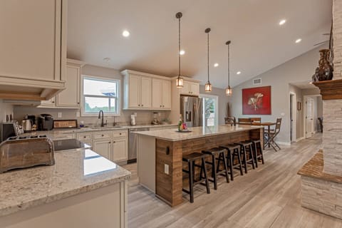 Split-level floor plan has secluded master suite on one side of the home and two guest suites on the opposite.