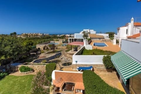 View from the terrace of the Penthouse apartment, over the water garden to pool.