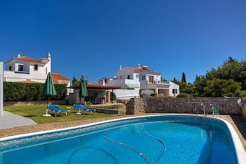 Swimming pool with Casa das Primas to the right overlooking ponds and garden