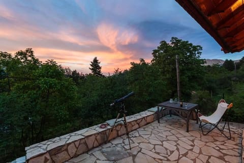 Sunset seat for dreamers.
EN: Watch the sunset paint the sky from your private forest terrace.