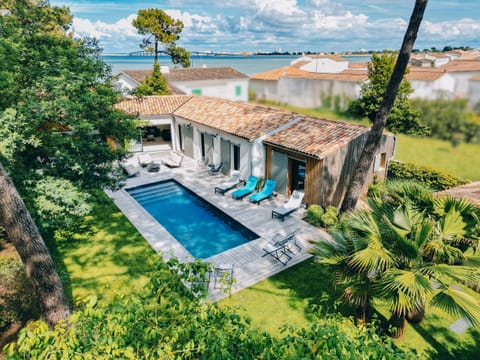 View of the villa and its heated outdoor swimming pool