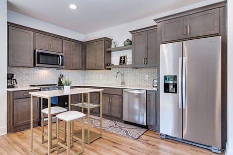 Relish the charm of our kitchen oasis, a perfect blend of warmth and practical design.