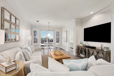 Comfortable living area with extra large flat screen Television.