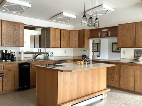 The large kitchen includes all major appliances, 6 burners, and 2 sinks! Fully stocked to cook and enjoy meals at home.