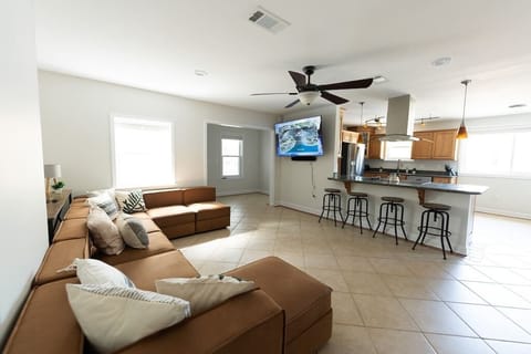 With the pool just outside, swing in for a refreshing drink or a break from the heat. Cuddle up on the huge couch for a movie night and popcorn for an evening in.