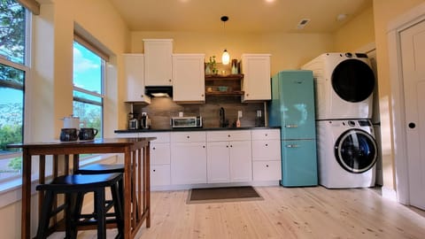 The kitchen has everything you need -and is cute, to boot!