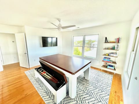 Switch pool table to a place to play games, puzzles, or other activities.