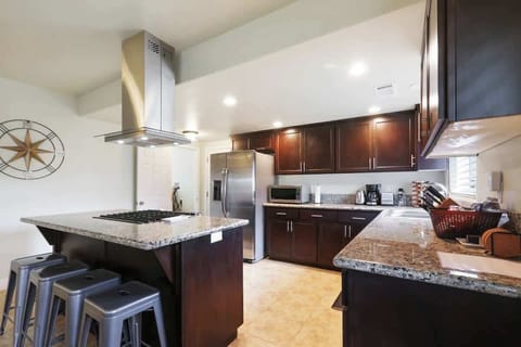 Gather with family around our unique island featuring a gas stove. 