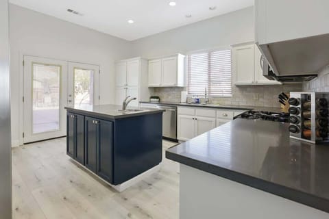 Kitchen island offers extra counter space for preparing meals