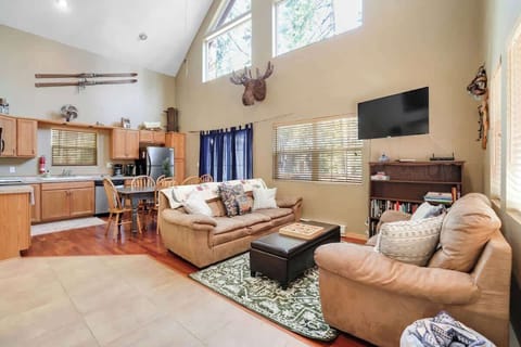 The great room features HD TV, Wifi, tons of windows to let in light and the views, fully stocked kitchen, dining room, and wood burning fireplace. Baseboard heaters help in the winter. This is the perfect space to gather!