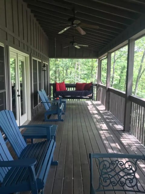 Large deck includes additional dining table and offers stunning lake views.