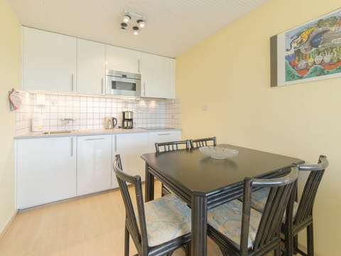 Furniture, Table, Property, Cabinetry, Countertop, Chair, Wood, Interior Design, Picture Frame, Kitchen & Dining Room Table