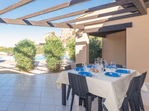 Plant, Property, Furniture, Table, Building, Azure, Chair, Shade, Interior Design, Tablecloth