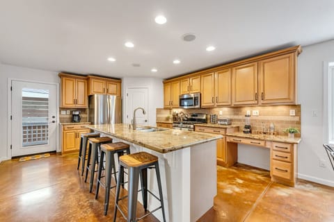 Sit down for a cup of coffee or meal at the bar stools at our kitchen island.