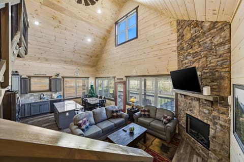 Gather around your spacious stone fireplace where soaring wood-beam ceilings and cozy leather seating create the perfect mountain retreat atmosphere.