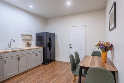 Moonlit: Enjoy seamless indoor-outdoor living with the corner door in Kitchen 2, offering easy access to the entrance and the outdoors! 🏡🌼