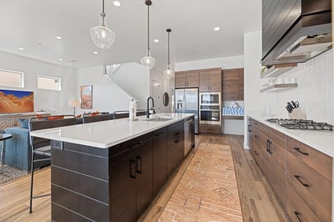 Large kitchen stocked with appliances and utensils for cooking
