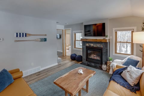 cozy fireplace and tasteful decor in living room 