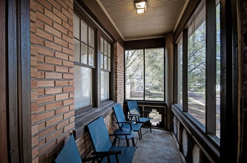 Sitting on the front, screened in porch.