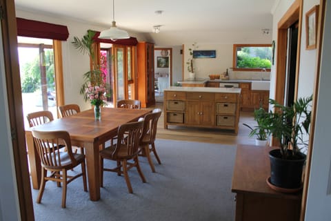 The house is open-plan, with multiple light-filled living spaces. 